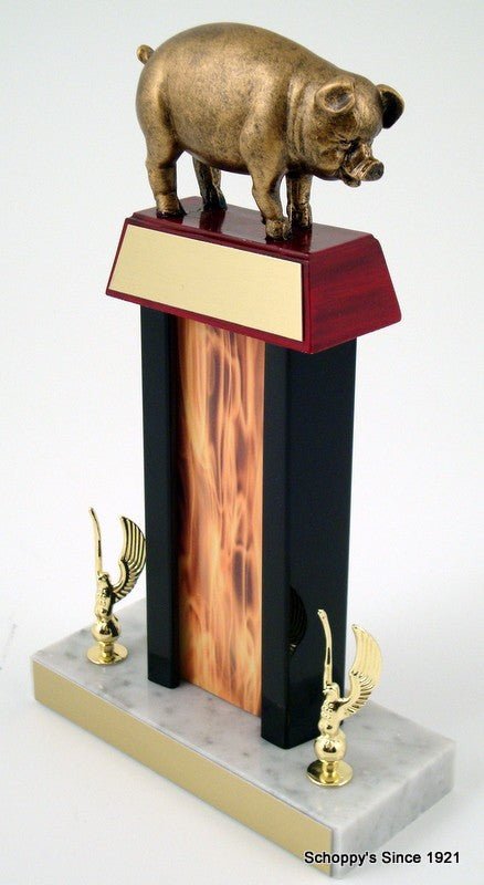 Pig Flaming Column Trophy with a pig resin figure on trapezoid wood base with gold engraving plate, all atop a white marble base that has two golden eagle figures and gold engraving plate