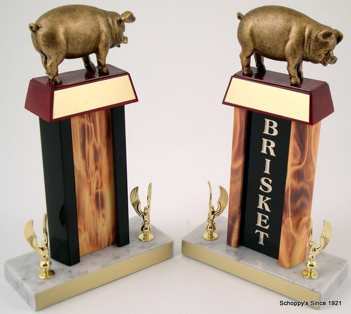 Pig Flaming Column Trophy with a pig resin figure on trapezoid wood base with gold engraving plate, all atop a white marble base that has two golden eagle figures each and gold engraving plates